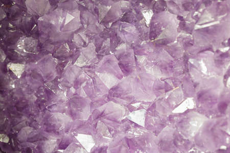 Natural amethyst crystal background. Amethyst is a violet variety of quartzの写真素材