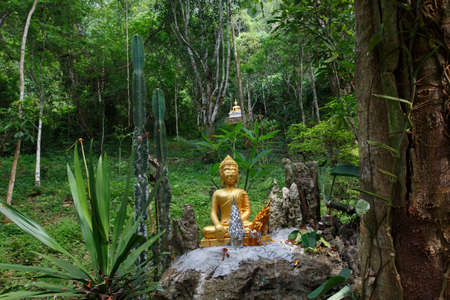 Laos People's Democratic Republic, Luang Prabang - 7 May:The Golden Buddha in the original forest in Laos ,Luang Prabang, Kansai falls,7 May ,2015のeditorial素材