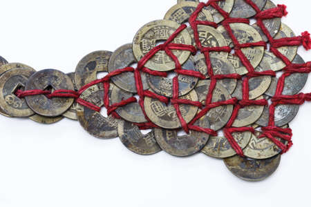 The  Qing Dynasty coins connected  by  red ropeの写真素材
