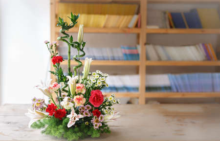 flower arrangement  and bookshelfの写真素材