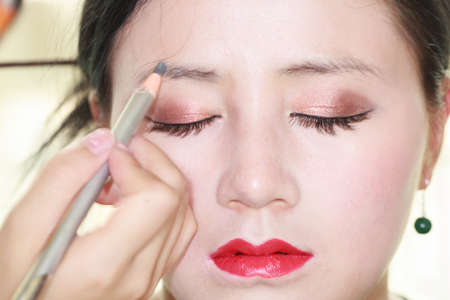 Asian girls are making up face featureの写真素材