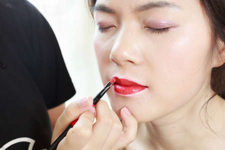 Asian girls are making up face featureの写真素材