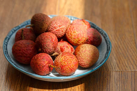 A plate of fresh litchiの写真素材