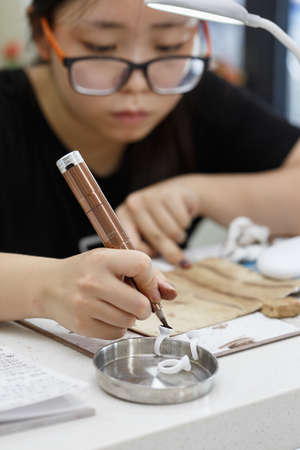 An Asian girl in the practice of eyebrow