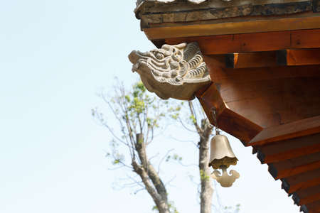 Dragon stone carving and wood roofの写真素材