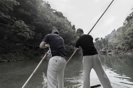 Two men punting on the riverのeditorial素材