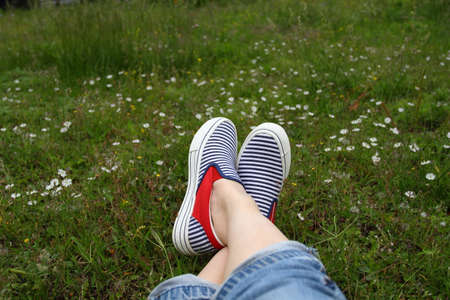A pair of women's feet on the grassの写真素材