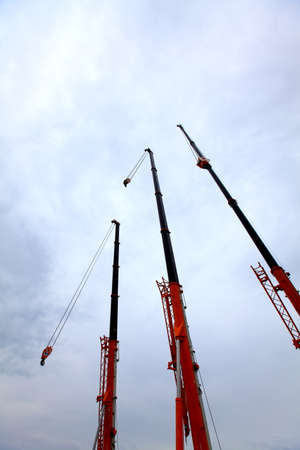 Three hanging arms under the blue sky