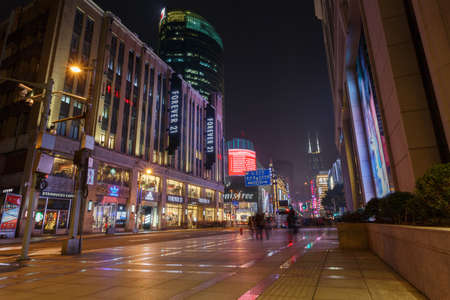 Shanghai,China - on December 19, 2016 ,Nanjing Road commercial street scene at dusk.Nanjing road is one of the most prosperous neighborhood in Shanghaiのeditorial素材