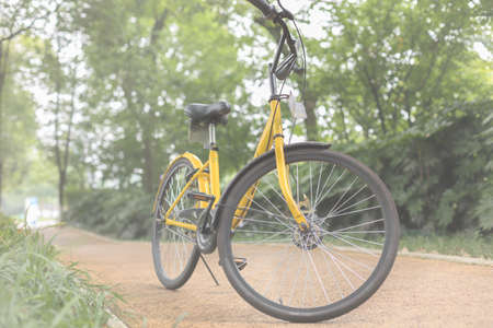 A yellow bicycle on the Boulevardの写真素材