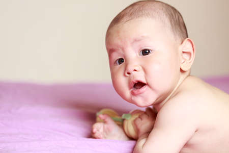 A smiling baby boy; head closeup