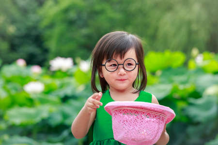 A little girl with pink hat