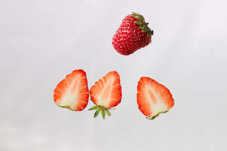 The red strawberry sliced still life on the white backgroundの写真素材