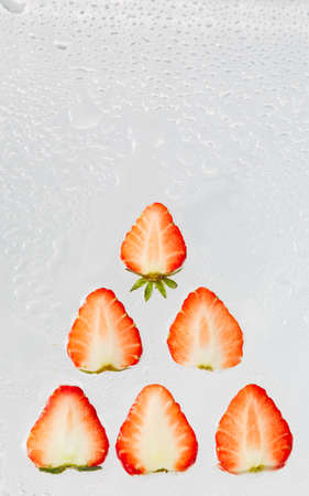 The red strawberry sliced still life on the white backgroundの写真素材