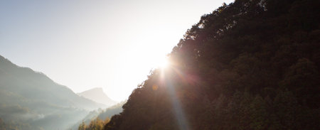Beautiful sunrise in the mountains. Panoramic view of the mountain valley.