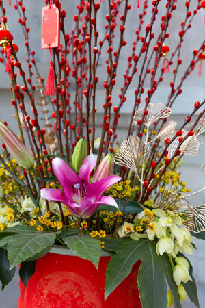 Bouquet of flowers in a vase with a red ribbonの写真素材