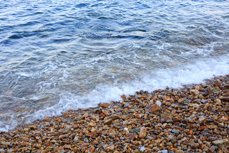 Sea waves on the pebble beach of the Black Sea.の写真素材