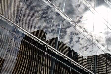 The sky against a modern glass building