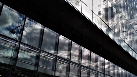 The sky against a modern glass buildingのeditorial素材