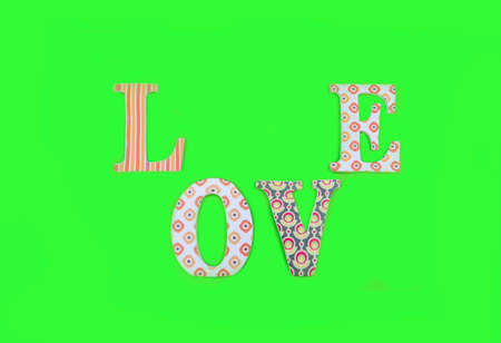 Vintage wooden love letters on green background with copy space. Romanticism concept.の写真素材