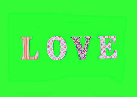 Vintage wooden love letters on green background with copy space. Romanticism concept.の写真素材