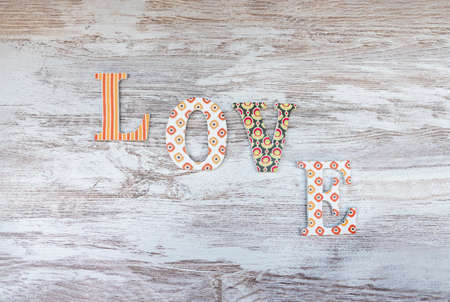 Vintage wooden love letters on rustic background with copy space. Romanticism concept.の写真素材