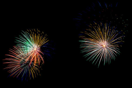 colorful fireworks blast at nightの写真素材