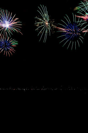 exploding colour fireworks at nightの写真素材