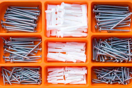 top view of a box with screws and anchors box - suitable as backgroundの写真素材