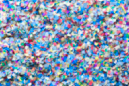 unfocused confetti background consisting of small pieces of colored paper  - suitable as copy spaceの写真素材