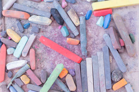 closeup of a box with colored chalks useful as a background - focus on the center of the imageの写真素材