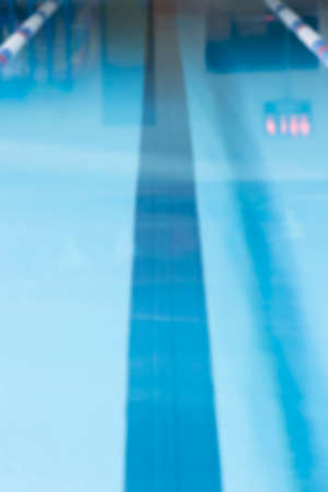 unfocused indoor swimming pool lane useful as a background - focus on the center of the image