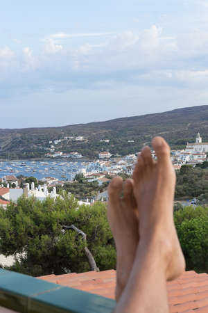 Beautiful scenery with unfocused man bare feet on foreground.Copy space.