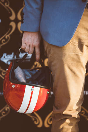 close-up of unrecognizable man with red helmet with white stripes and cloth insideの写真素材