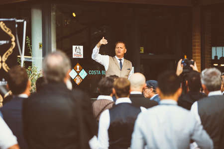 ALICANTE, SPAIN - SEPTEMBER 25, 2016: The event organizer is giving a speech telling the instructions to the riders on the Distinguished Gentleman's Ride day, a global fundraiser for prostate cancer and men's health investigationのeditorial素材