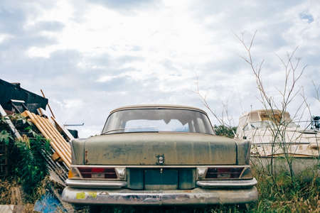 View of classic rusty car bumper against of cloudy skyの写真素材