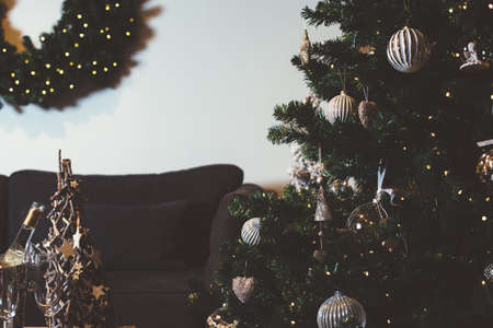 Close up fir tree with baubles in living room decorated to Christmas. の写真素材