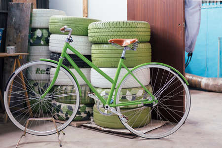 View on newly constructed green bicycle in garageの写真素材
