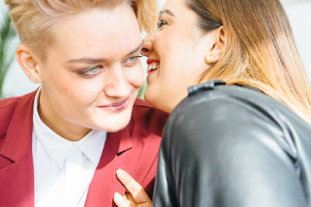 Young stylish girlfriends having time together and talking.の写真素材