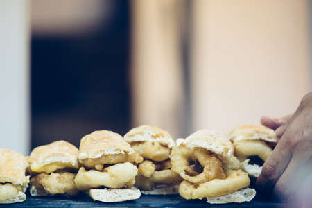 Close up of a tray of spanish tapas of fried squid rings ready to serve