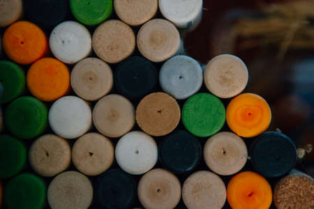 Heap of colored wine stoppers stacked in a wine cellar. Useful as a background