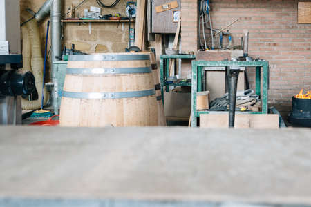 Close up of the view of a wooden wine barrel in process of manufacturing in a factory. Exterior view
