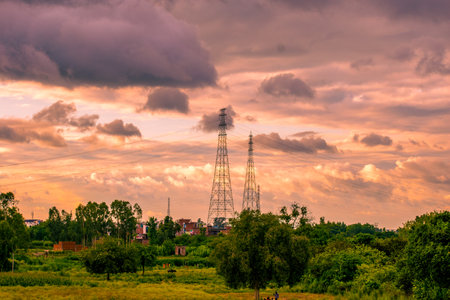 High-voltage tower on a background of blue sky with cloudsの写真素材