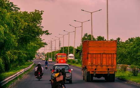 Red bus on the street of India.の写真素材