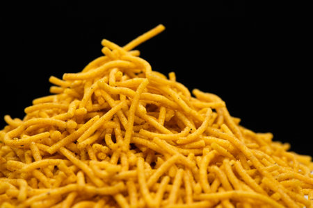 Alu bhujiya sev Indian snacks or namkeen in black backgroundの写真素材