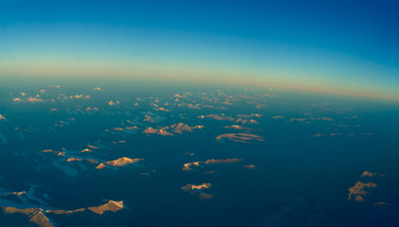 Aerial view of clouds and blue sky with sunbeams.の写真素材