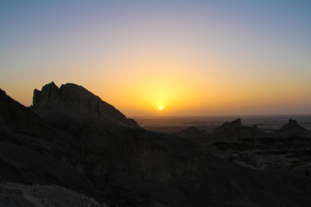 Sunset at sky and mountainsの写真素材