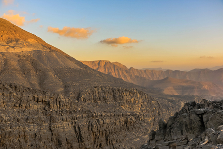Geological landscape of Jabal Jais characterised by dry and rocky mountains, Mud Mountains in Ras Al Khaimah, United Arab Emiratesの写真素材