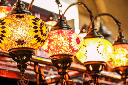 Traditional bright decorative hanging Turkish lamps and colourful lights with vivid colours  in the...