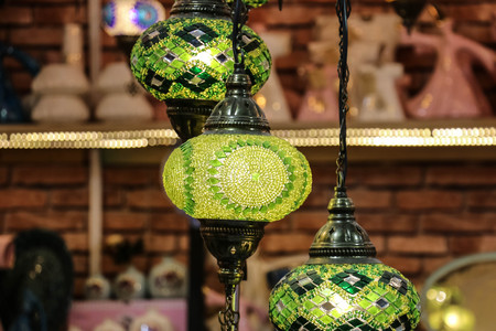 Traditional bright decorative hanging Turkish lamps and colourful lights with vivid colours  in the...